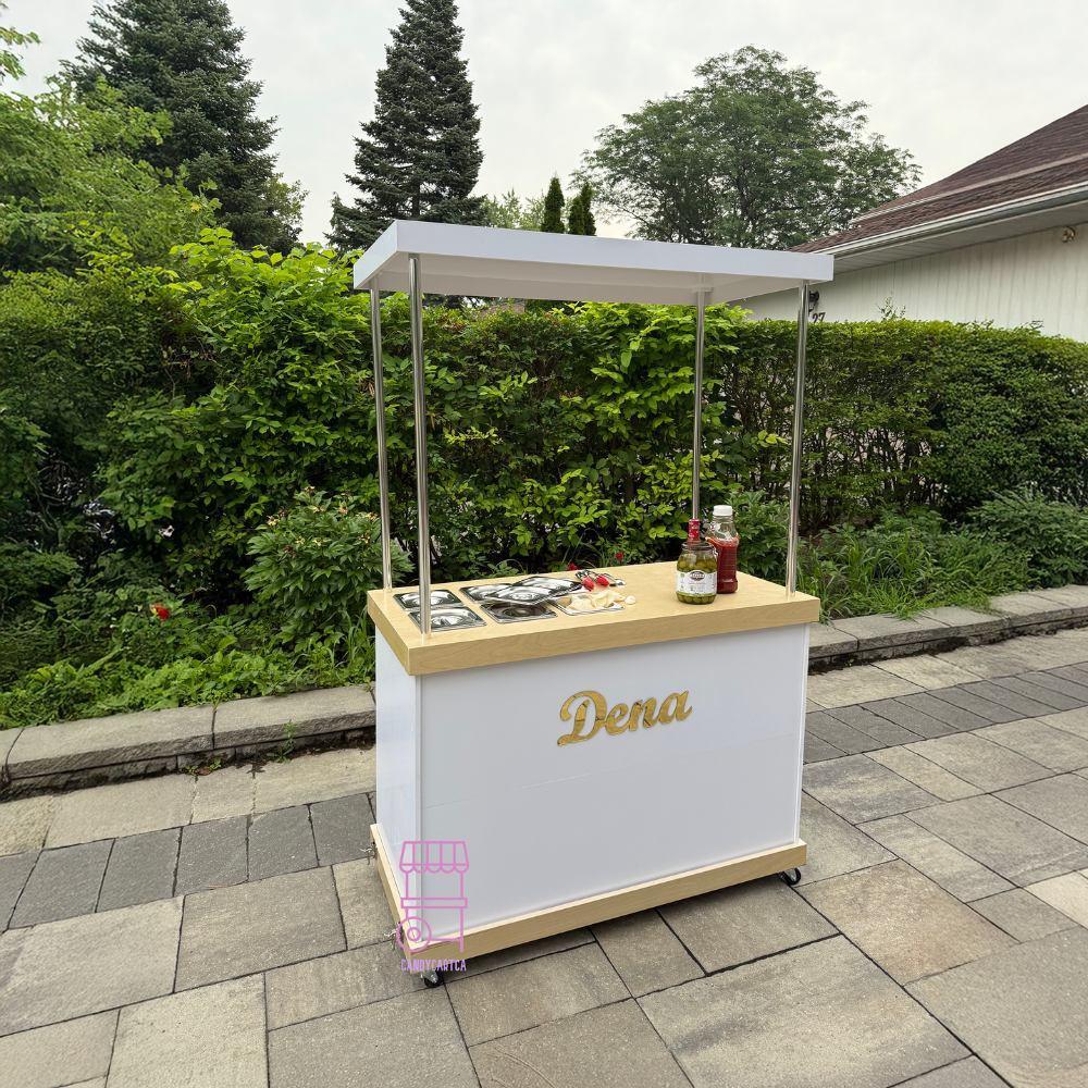 Portable food cart with 'Dena' branding on a patio