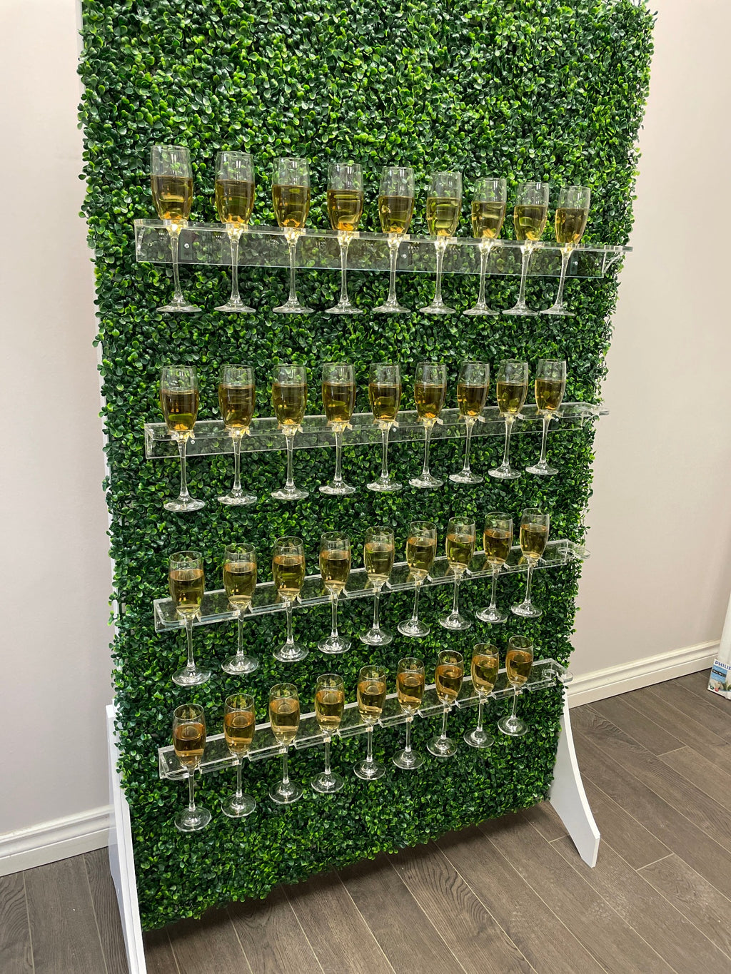 Grass wall champagne wall, drink holder for bridal showers and weddings, champagne wall for birthdays, grass wall backdrop with drink holders image.