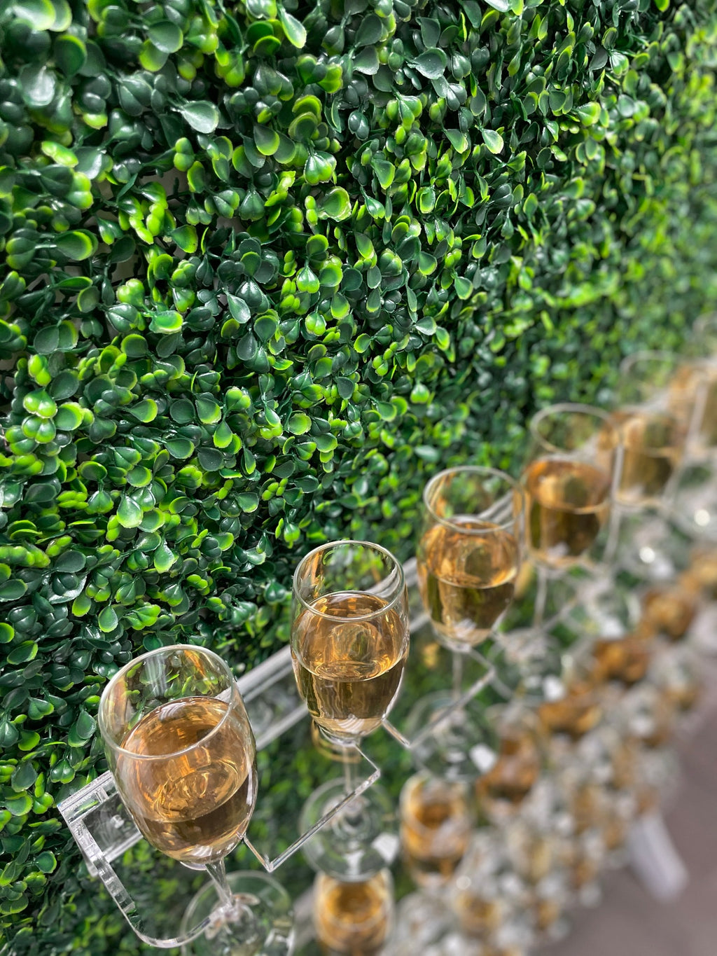 Grass wall champagne wall, drink holder for bridal showers and weddings, champagne wall for birthdays, grass wall backdrop with drink holders image.