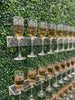 Grass wall champagne wall, drink holder for bridal showers and weddings, champagne wall for birthdays, grass wall backdrop with drink holders image.